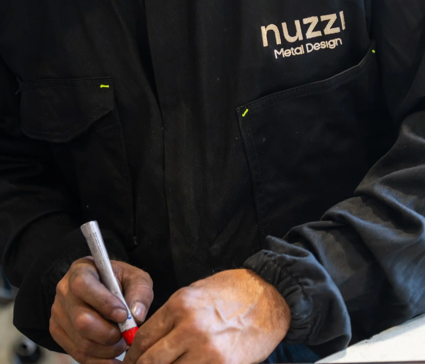 Marking out a steel tube by hand in the Nuzzi Metal Design workshop